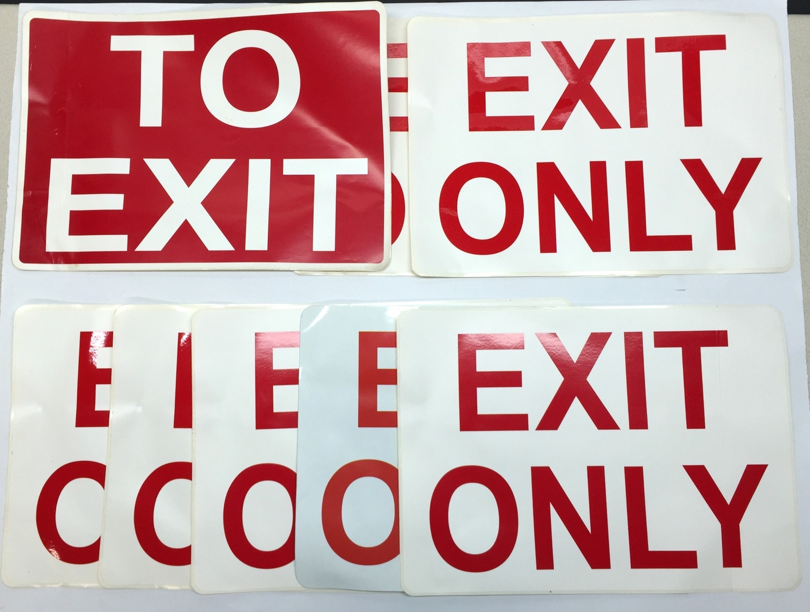 Unbranded 14″x10″ ‘Exit Only’ (7)/ ‘To Exit’ (1) Adhesive Back Signage NOS